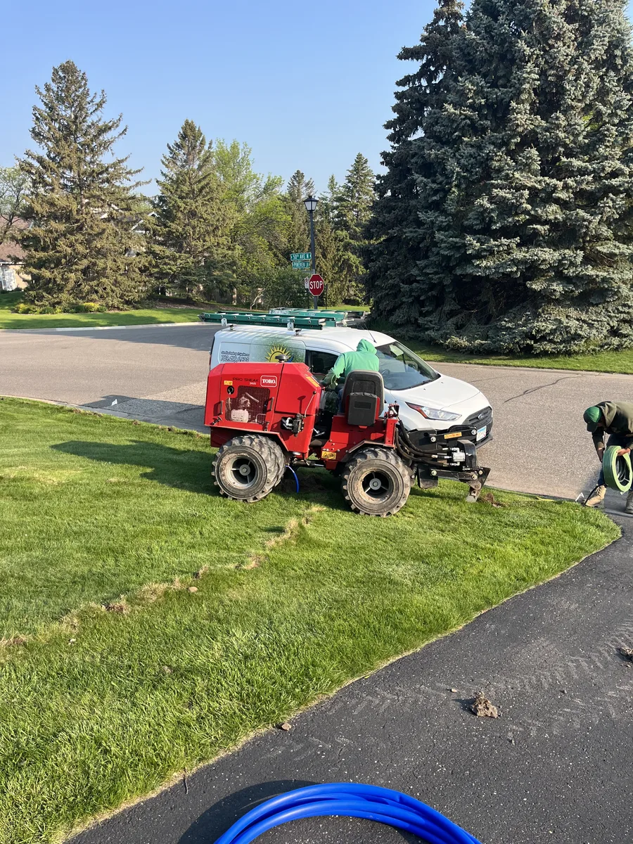 Toro pipe-boring machine on a customer's lawn during installation